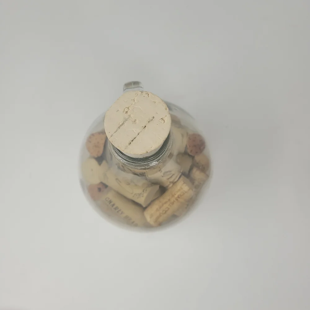 GLASS JAR OF WINE CORKS